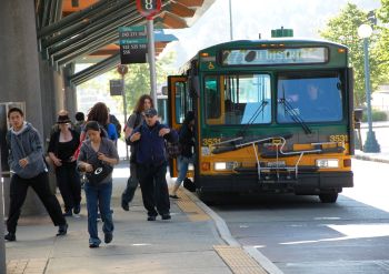 image of bus and riders at downtown transit center