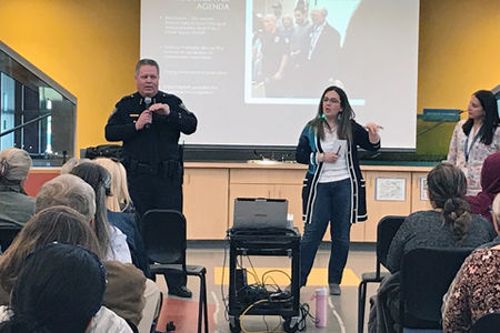 A group of people in a class, including the Police chief talking