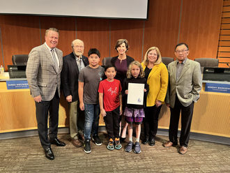 Bellevue students accept a safe walk to school proclamation.