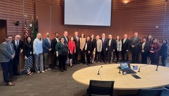 City employees pose with the City Council for a Public Service Recognition Week proclamation.