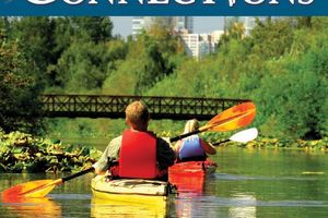 Two people kayaking through Mercer Slough.