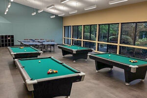 image of games room showing pool tables and table tennis tables